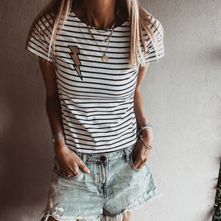 Gold lighting on light Breton striped tee